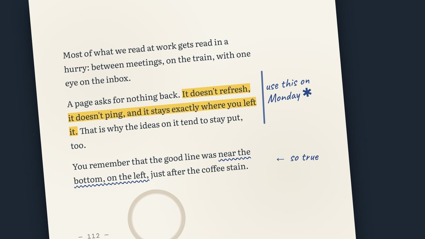 Close-up of a printed page with a highlighted sentence, a wavy pencil underline, handwritten margin notes and a coffee ring